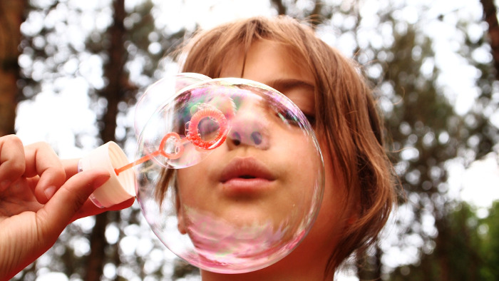 Child Blowing Bubbles